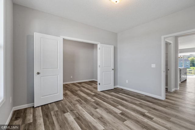 17205 61st St NE, Otsego, MN 55330 - unfurnished room featuring wood finished floors and baseboards