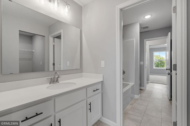 17205 61st St NE, Otsego, MN 55330 - full bath with vanity, bathtub / shower combination, tile patterned flooring, and a textured ceiling
