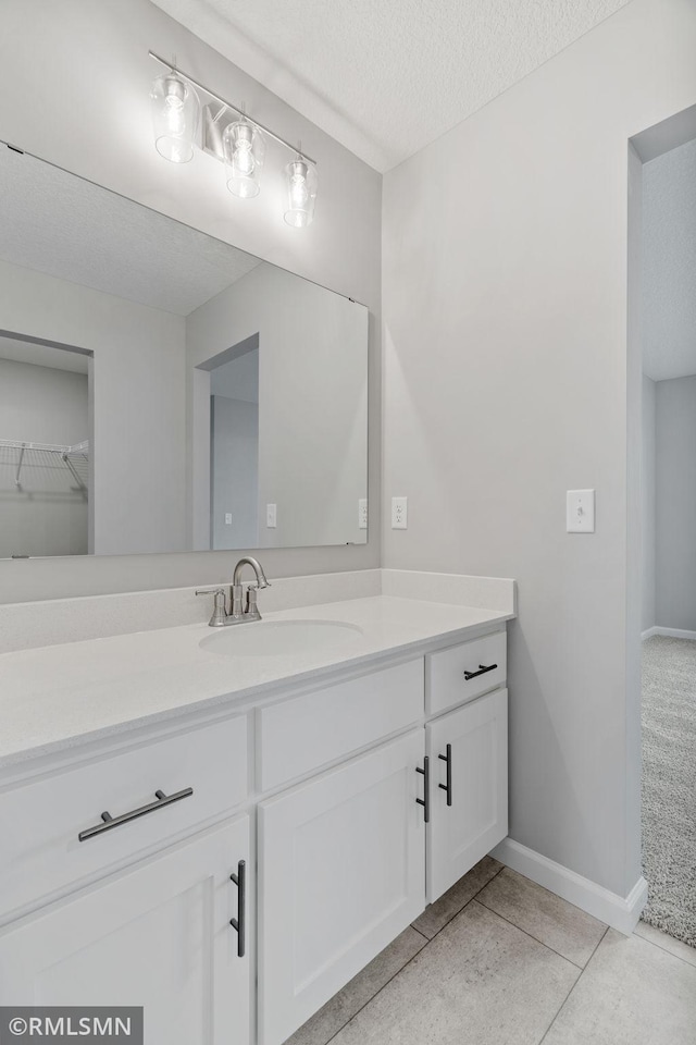 17205 61st St NE, Otsego, MN 55330 - bathroom with vanity, a textured ceiling, and tile patterned floors