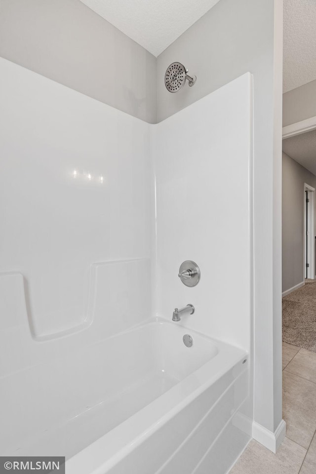 17205 61st St NE, Otsego, MN 55330 - full bath featuring shower / tub combination, a textured ceiling, and tile patterned flooring