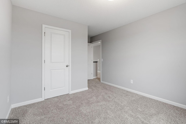 17205 61st St NE, Otsego, MN 55330 - unfurnished bedroom with carpet flooring and baseboards