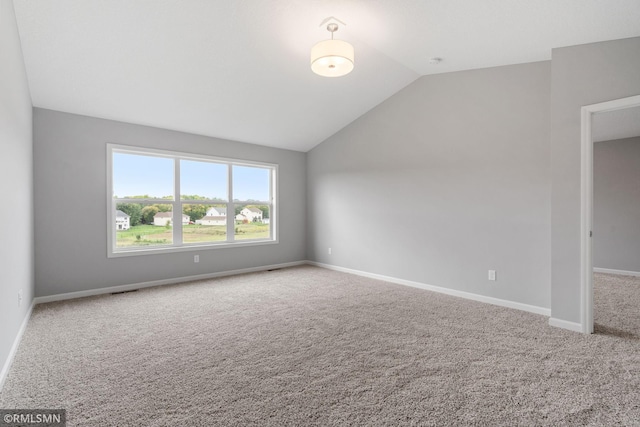 17205 61st St NE, Otsego, MN 55330 - carpeted spare room with lofted ceiling and baseboards