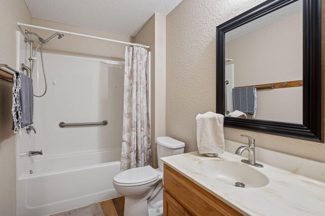 1600 Arundel St Unit 201, Saint Paul, MN 55117 - full bathroom with shower / bathtub combination with curtain, vanity, a textured wall, wood finished floors, and a textured ceiling