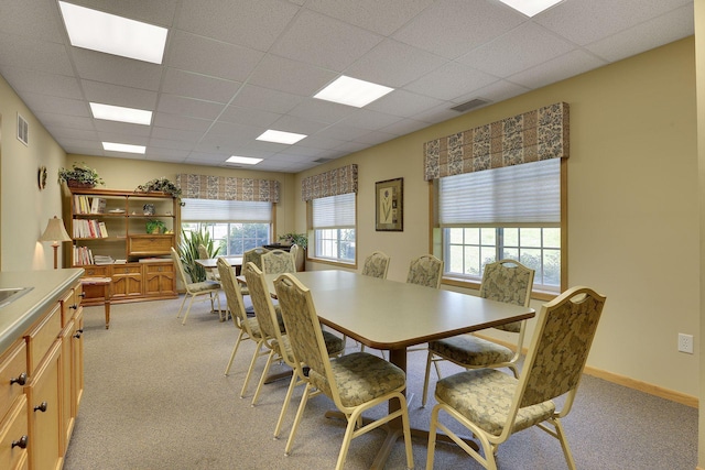 1600 Arundel St Unit 201, Saint Paul, MN 55117 - dining area featuring a paneled ceiling and light colored carpet