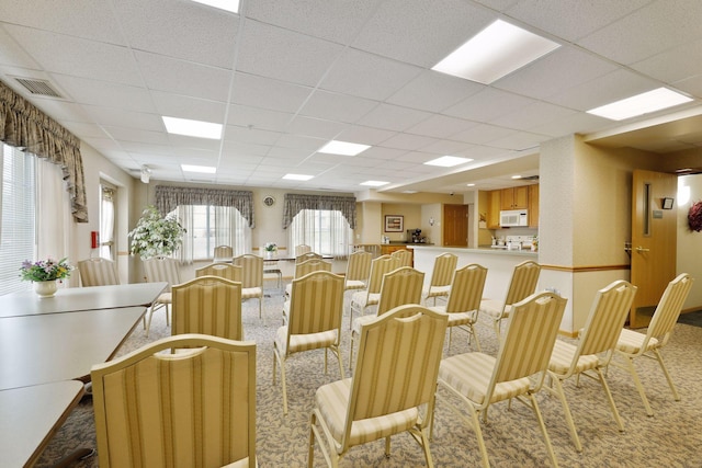 1600 Arundel St Unit 201, Saint Paul, MN 55117 - dining space with a paneled ceiling and carpet flooring