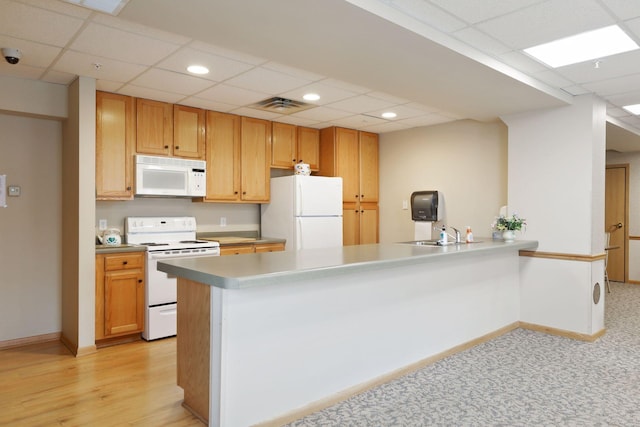 1600 Arundel St Unit 201, Saint Paul, MN 55117 - kitchen with white appliances, a drop ceiling, a peninsula, and recessed lighting