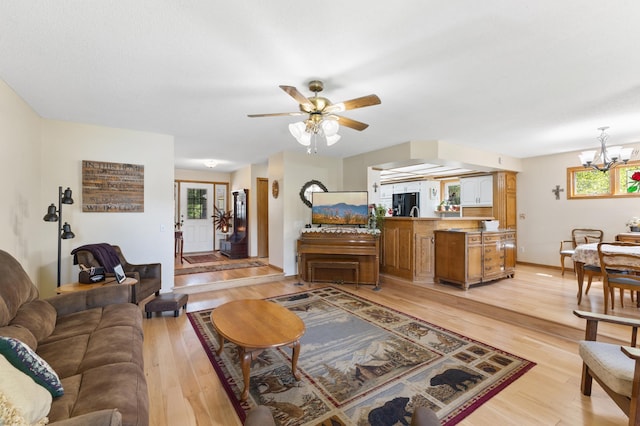 30190 Terryll St, Lindstrom, MN 55045 - living area with a chandelier, light wood-type flooring, and ceiling fan