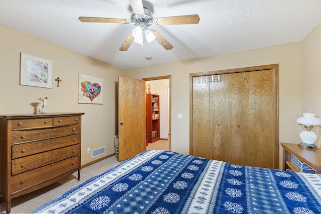 30190 Terryll St, Lindstrom, MN 55045 - bedroom featuring a closet, carpet, a ceiling fan, and a textured ceiling