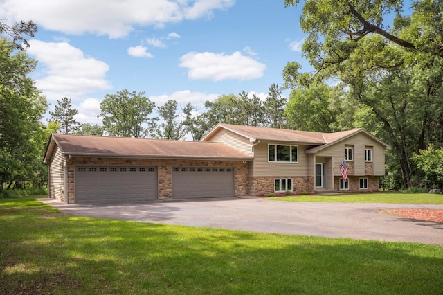 14744 Evergreen St NW, Andover, MN 55304 - view of front of property featuring driveway, an attached garage, and a front lawn