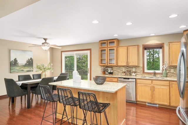 14744 Evergreen St NW, Andover, MN 55304 - kitchen featuring stainless steel appliances, healthy amount of natural light, dark wood-style flooring, a breakfast bar, and recessed lighting