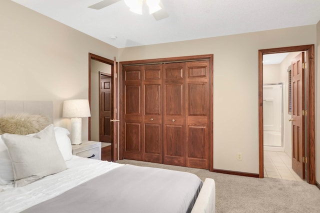 14744 Evergreen St NW, Andover, MN 55304 - bedroom with light carpet, a closet, ensuite bathroom, and ceiling fan
