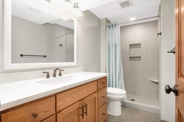 14744 Evergreen St NW, Andover, MN 55304 - bathroom with vanity, tiled shower, and tile patterned floors