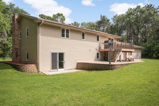 14744 Evergreen St NW, Andover, MN 55304 - back of property featuring a patio, stairway, a wooden deck, a chimney, and a lawn