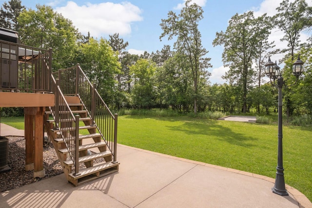 14744 Evergreen St NW, Andover, MN 55304 - view of patio featuring stairs, view of wooded area, and a deck