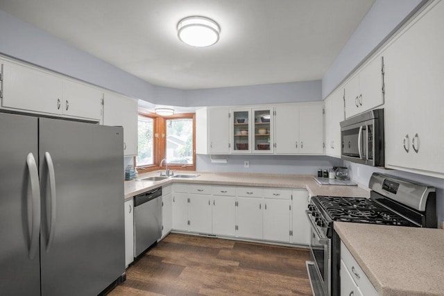4111 Auburn Dr, Minnetonka, MN 55305 - kitchen featuring stainless steel appliances, dark wood-type flooring, and white cabinets