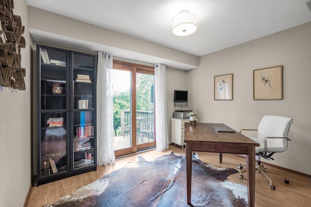 4111 Auburn Dr, Minnetonka, MN 55305 - office featuring wood finished floors and a textured ceiling