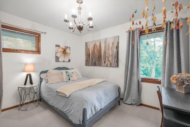 4111 Auburn Dr, Minnetonka, MN 55305 - carpeted bedroom with a chandelier and baseboards