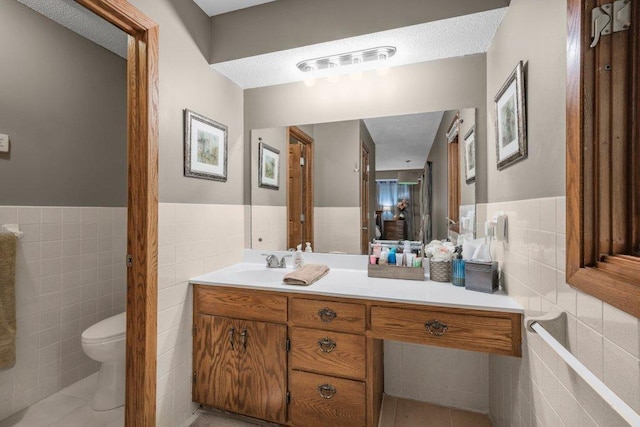 4111 Auburn Dr, Minnetonka, MN 55305 - bathroom with tile walls, tile patterned flooring, vanity, and wainscoting