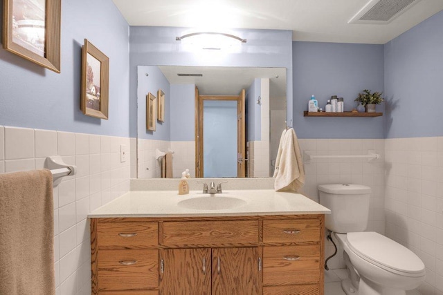 4111 Auburn Dr, Minnetonka, MN 55305 - bathroom featuring tile walls, vanity, and wainscoting