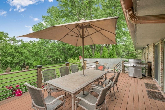 4111 Auburn Dr, Minnetonka, MN 55305 - wooden terrace featuring outdoor dining area, area for grilling, and view of wooded area