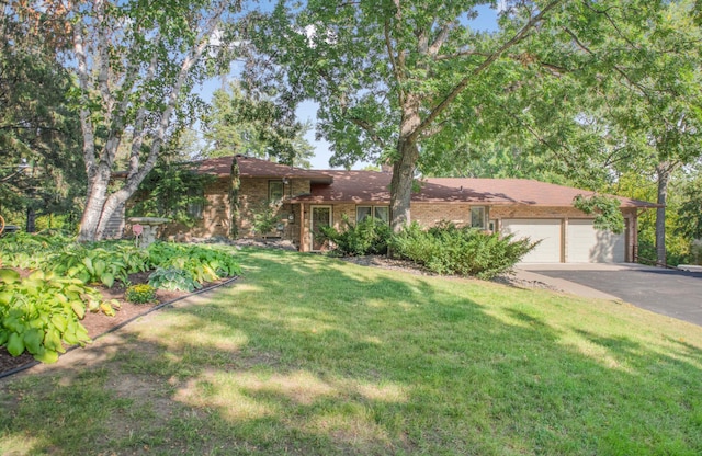 4111 Auburn Dr, Minnetonka, MN 55305 - view of front facade with a garage, driveway, a front yard, and brick siding