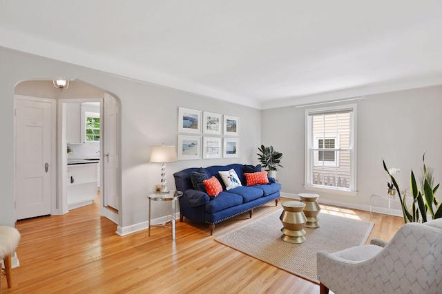 5521 Emerson Ave S, Minneapolis, MN 55419 - living room featuring arched walkways and light wood-style flooring