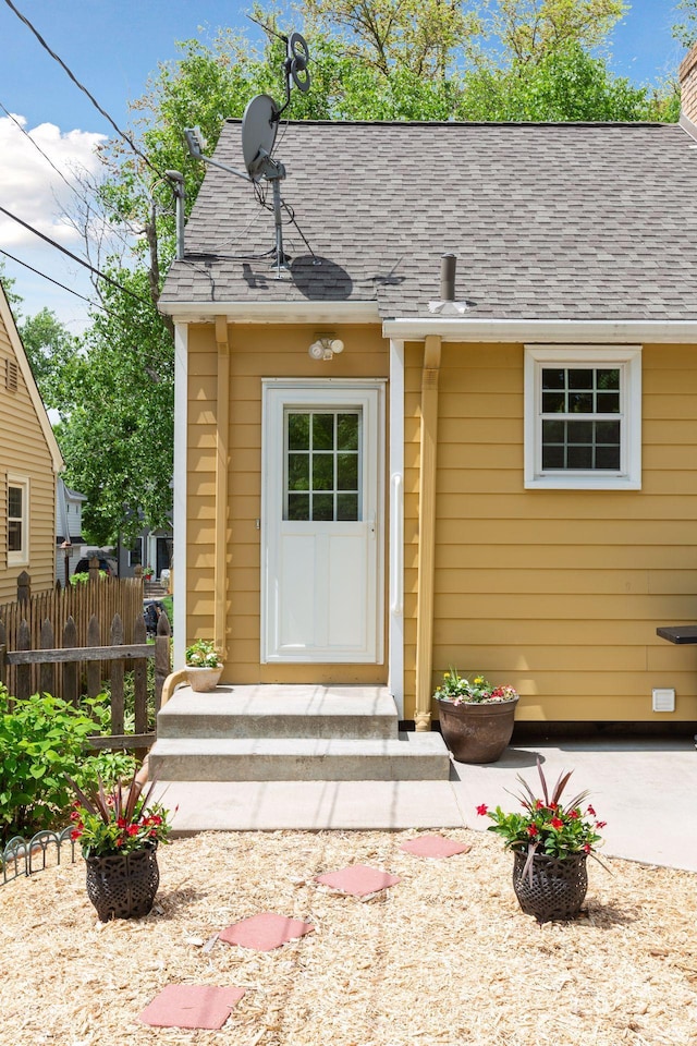 5521 Emerson Ave S, Minneapolis, MN 55419 - view of exterior entry with a shingled roof