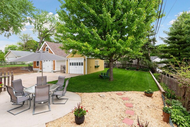 5521 Emerson Ave S, Minneapolis, MN 55419 - view of patio / terrace with an outdoor structure, a garage, and outdoor dining space