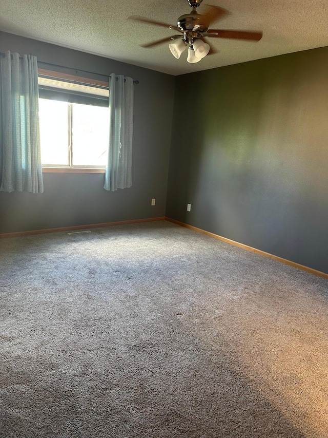 2460 Fox Hollow Ln, Owatonna, MN 55060 - unfurnished room featuring ceiling fan, a textured ceiling, and carpet