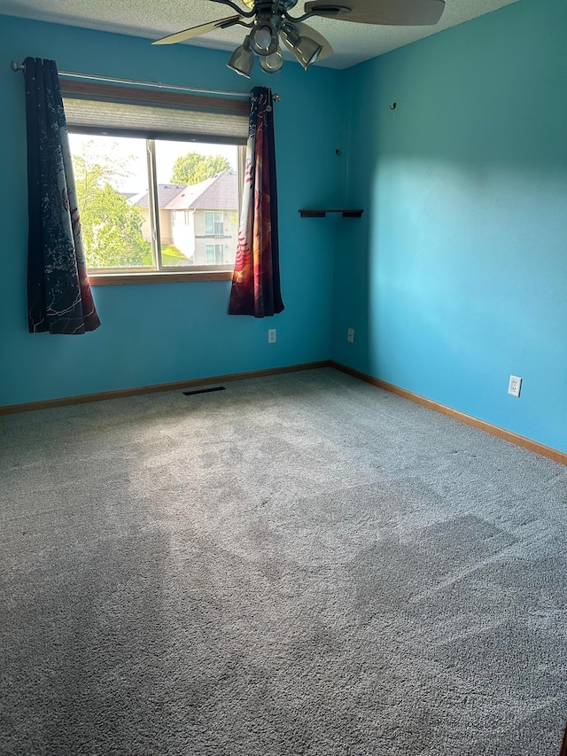 2460 Fox Hollow Ln, Owatonna, MN 55060 - empty room featuring a ceiling fan and carpet