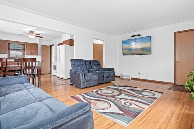 3836 Buchanan St NE, Columbia Heights, MN 55421 - living room with light wood-style floors and a ceiling fan