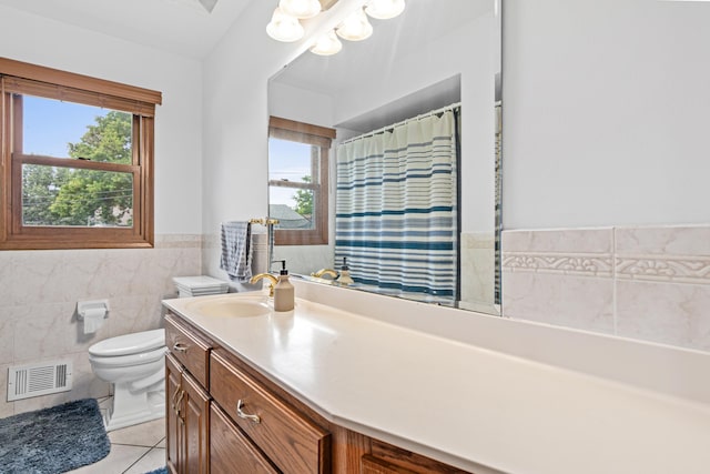 3836 Buchanan St NE, Columbia Heights, MN 55421 - full bathroom with tile patterned flooring, tile walls, vanity, wainscoting, and curtained shower