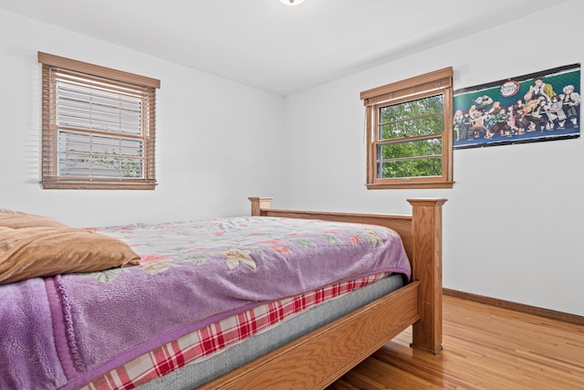 3836 Buchanan St NE, Columbia Heights, MN 55421 - bedroom featuring wood finished floors and baseboards