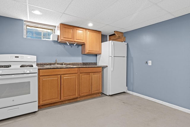 3836 Buchanan St NE, Columbia Heights, MN 55421 - kitchen featuring white appliances, finished concrete flooring, a paneled ceiling, dark countertops, and brown cabinets