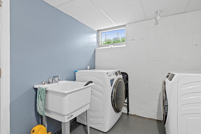 3836 Buchanan St NE, Columbia Heights, MN 55421 - laundry area featuring washing machine and dryer and concrete block wall