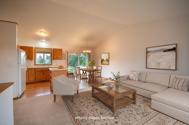706 Country Club Dr SW, Melrose, MN 56352 - living area featuring a chandelier, lofted ceiling, and light colored carpet