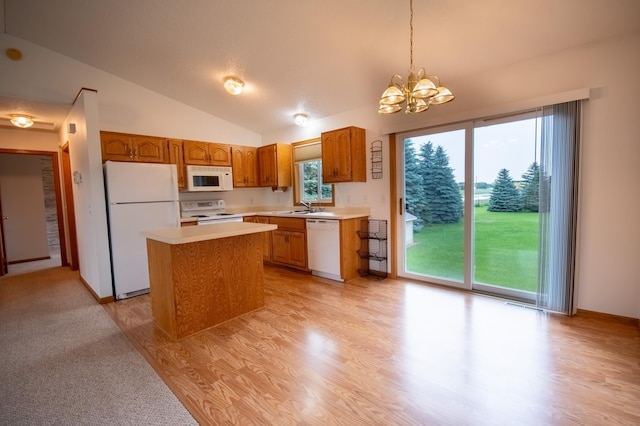 706 Country Club Dr SW, Melrose, MN 56352 - kitchen with white appliances, light countertops, vaulted ceiling, a chandelier, and a center island