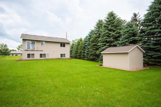 706 Country Club Dr SW, Melrose, MN 56352 - rear view of property with a yard and a storage unit