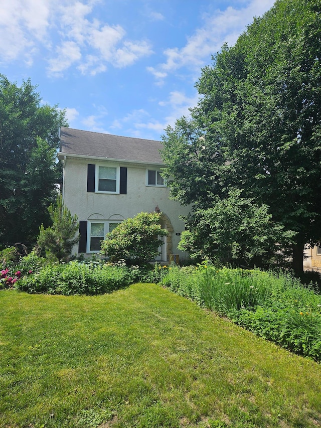 129 50th St, Minneapolis, MN 55419 - view of front facade with stucco siding and a front lawn