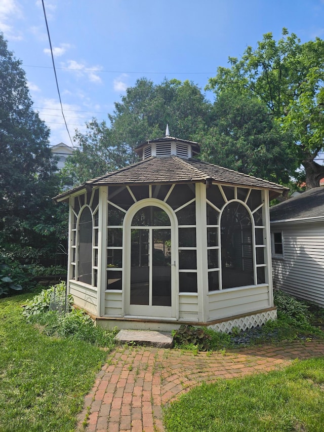 129 50th St, Minneapolis, MN 55419 - rear view of property featuring a sunroom
