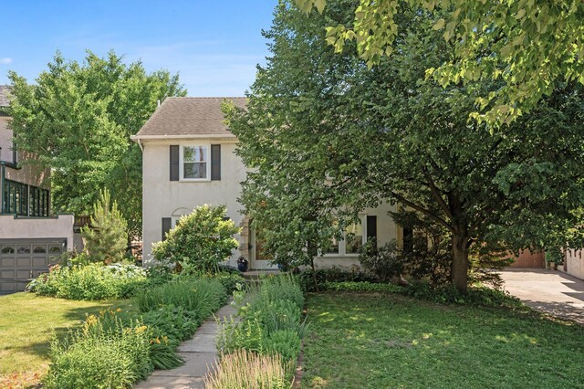 129 50th St, Minneapolis, MN 55419 - view of property hidden behind natural elements with stucco siding and a front yard