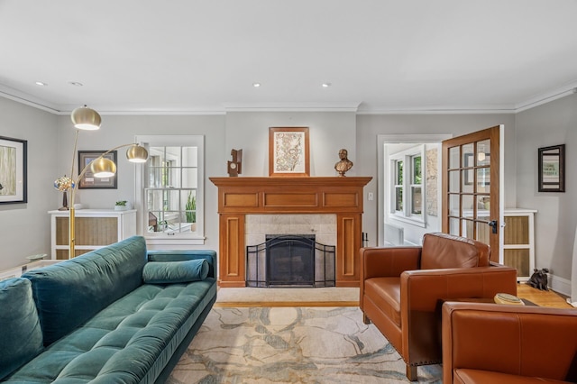 129 50th St, Minneapolis, MN 55419 - living room with crown molding, a fireplace, and light wood-style floors