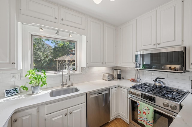129 50th St, Minneapolis, MN 55419 - kitchen featuring appliances with stainless steel finishes and white cabinets