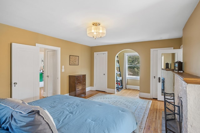 129 50th St, Minneapolis, MN 55419 - bedroom featuring wood finished floors and arched walkways