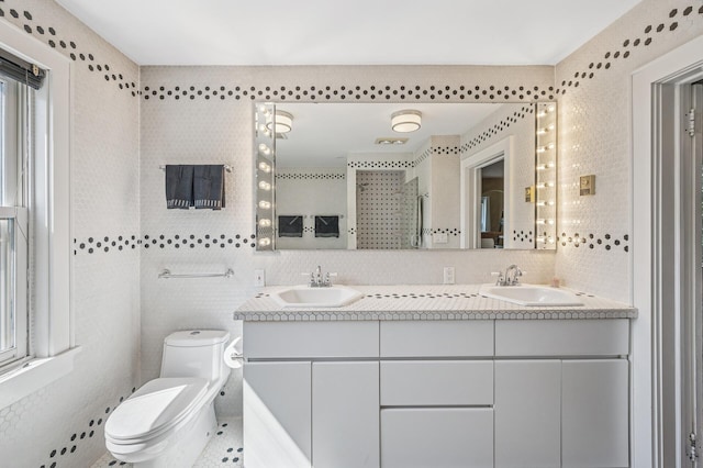 129 50th St, Minneapolis, MN 55419 - bathroom featuring double vanity, a shower, and tasteful backsplash