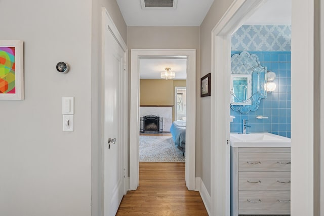 129 50th St, Minneapolis, MN 55419 - hallway with a sink and wood finished floors