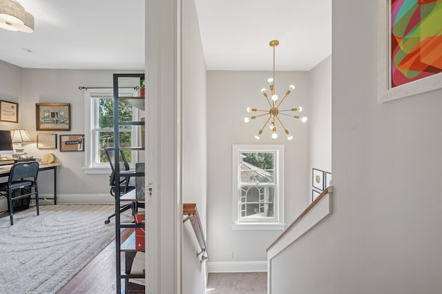 129 50th St, Minneapolis, MN 55419 - stairway with a chandelier and wood finished floors