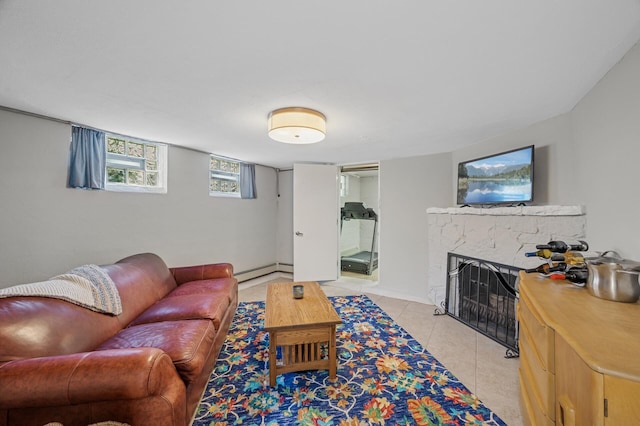 129 50th St, Minneapolis, MN 55419 - living area with a baseboard heating unit, light tile patterned floors, and a fireplace