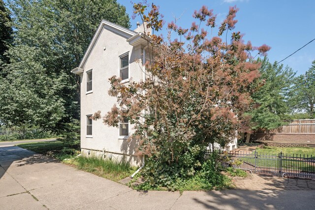 129 50th St, Minneapolis, MN 55419 - view of side of property with stucco siding