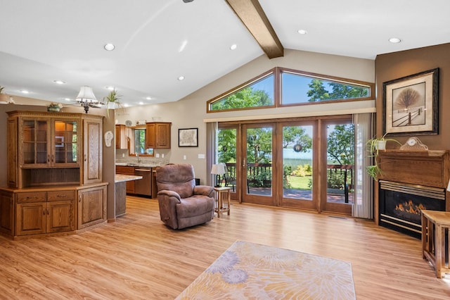 7023 State Highway 114 SW, Lake Mary Twp, MN 56308 - living room with beam ceiling, light wood-type flooring, a glass covered fireplace, recessed lighting, and high vaulted ceiling